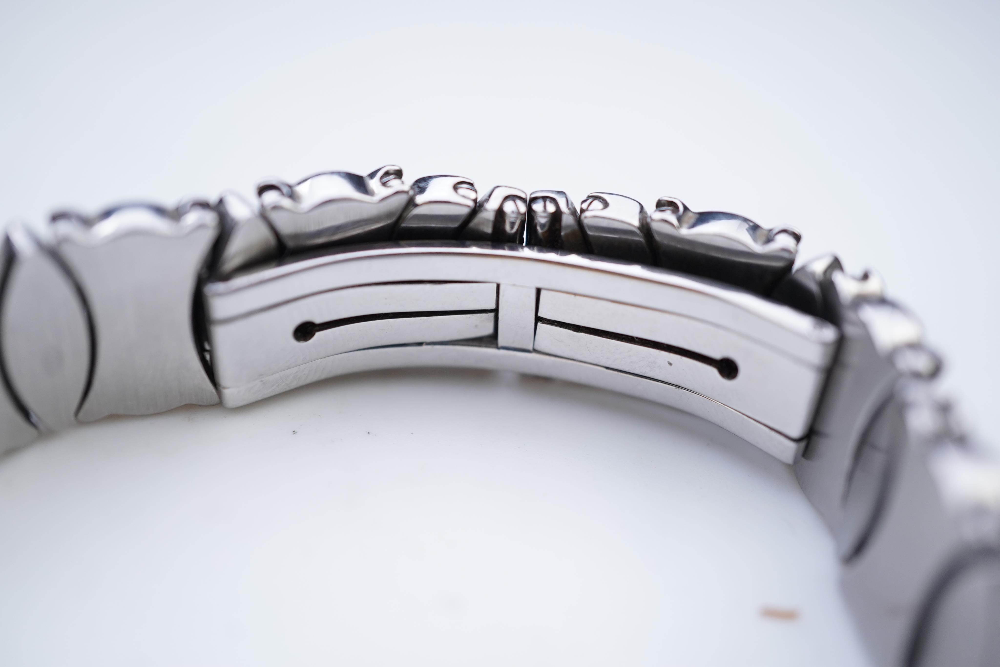 Cartier, a lady's gold and stainless steel wristwatch, 'Colisée', ref.8057908C